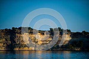 Image of a rocky penninsula on a lake