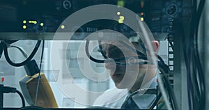 Image of round scanners and data processing over caucasian male engineer working at server room