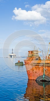 An image of a rusty iron barge with reflections. photo