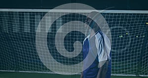 Image of scanner processing data over african american male footballer in front of goal