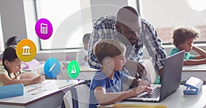 Image of school icons over african americ male teacher and schoolboy using laptop in class photo
