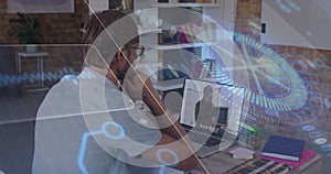 Image of scope scanning and data processing over caucasian businessman using laptop