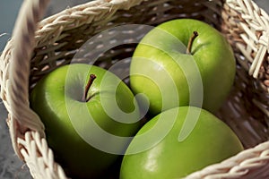 An image select focus close-up apple green fresh is fruit or food for health contain in a basket with light and shadow, relying on