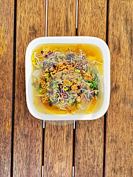 An image of self-cooked asian cousine dish on a wooden table photo