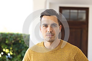 Image of serious caucasian man looking at camera