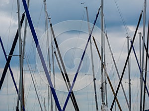 Image of several ship mast in the sky