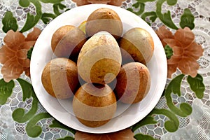 Sapodilla tropical fruit on a plate on the table
