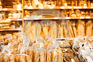 Image of shelves with variety bakery products in speciality department in the supermarket.