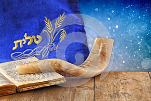 Image of shofar (horn) and prayer case with word talit (prayer) writen on it. room for text. rosh hashanah (jewish holiday)