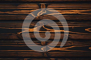 Dark Brown Wooden Planks with Visible Grain and Knots photo