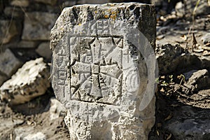 Ancient Stone Carving with Intricate Symbolic Designs