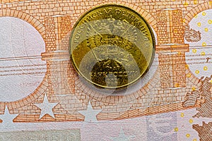 This image shows a 10 RUR coin over a euro banknote. It depicts the EU economy in crisis and recession due to sanctions