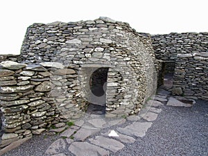 Ancient stone beehive hut colony of clochans, stone dry huts in rural Ireland