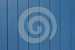 Exterior wall texture background with bright blue painted vertical wood siding