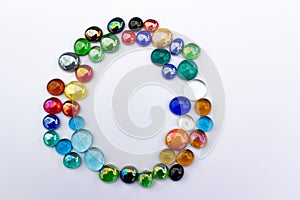 Abstract texture background of bright colorful glass bead dragon tears on plain background