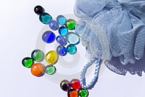 This image shows a close up abstract view of a sponge and bright colorful glass bead dragon tears