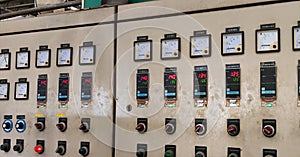 Industrial Control Panel With Digital Gauges and Switches in an Industrial Facility