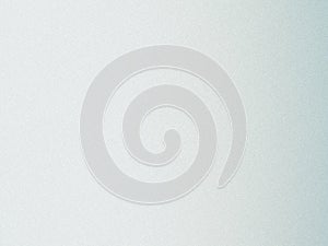 A close-up view of a textured and slightly blurred light gray surface