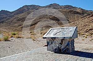 Vandalized educational marker for Frenchman Mountain, site of the Great Unconformaty near Las Vegas, Nevada. photo