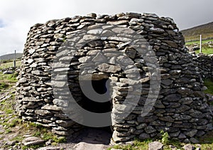 Ancient stone beehive hut, or clochan, a stone dry hut in rural Ireland