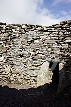 Ancient stone beehive hut, or clochan, stone dry hut in western Ireland