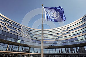 The image shows a large, modern municipal office building with a curved glass and steel façade