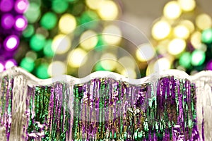 Macro abstract art texture background of bright traditional three colors of Mardi Gras beads