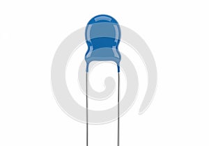 Close-up view of a single blue ceramic disc capacitor with two wire leads