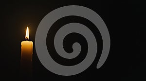 A single candle in the darkness.