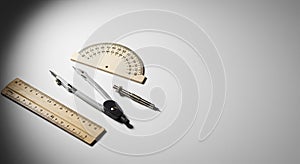 drafting tools still life on a white surface