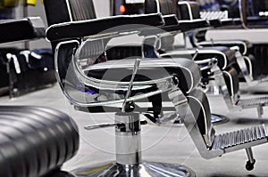 Empty armchairs in a beauty salon or barbershop photo