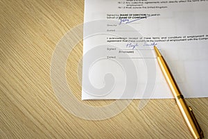Signed Employment Contract on Desk photo