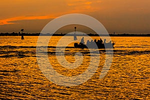 Image of silhouette of canoers
