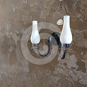 Image of simple vintage lamp on a citadel wall