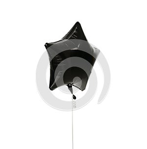 Image of single big black star latex balloon for birthday or wedding party