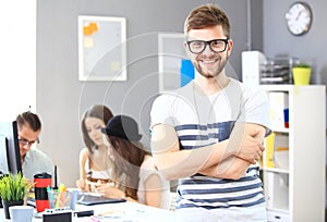 Image of smart young businessmen looking at camera