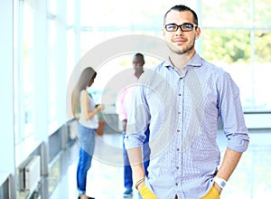 Image of smart young businessmen looking at camera