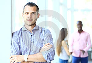 Image of smart young businessmen looking at camera