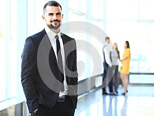 Image of smart young businessmen looking at camera