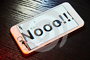 Image of smartphone with broken screen and the word Nooo!!! on it