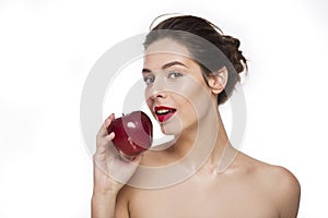 Image of smiling young girl with a red apple