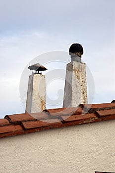 Smoke extraction chimneys located on top of the roof photo