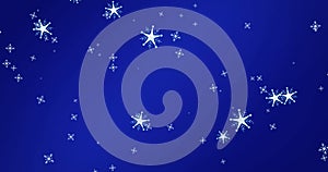 Image of snow flakes falling on blue background