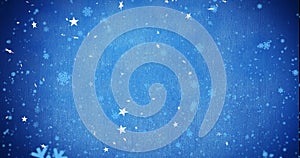Image of snow flakes falling on blue background