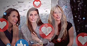 Image of social media reactions over happy caucasian female friends drinking wine and talking