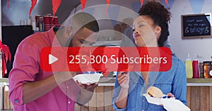 Image of social network subscribers notification over happy biracial couple at cafe