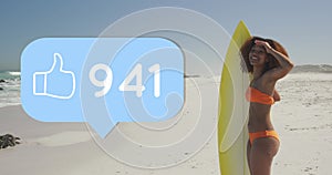 Image of speech bubble with thumbs up digital icon and numbers, woman with surfboard on beach