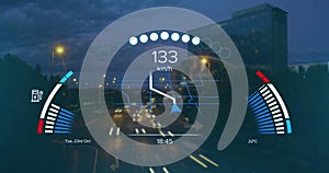 Image of speedometer, gps and charge data on interface, over sped up city traffic at night photo