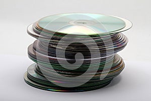 Image of a stack of DVDs and CDs taken from a sideways view