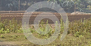 This is an image of stacks of raw bricks .